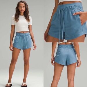 lululemon inner glow high rise short in acid blue